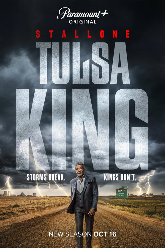 Tulsa King poster with Sylvester Stallone on a rural road beneath storm clouds and the Paramount Plus Original title