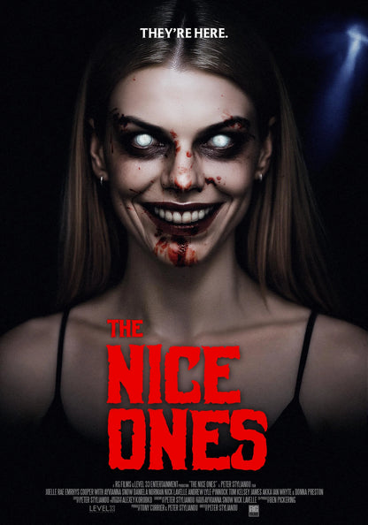 The Nice Ones horror poster showing a smiling woman with glowing white eyes