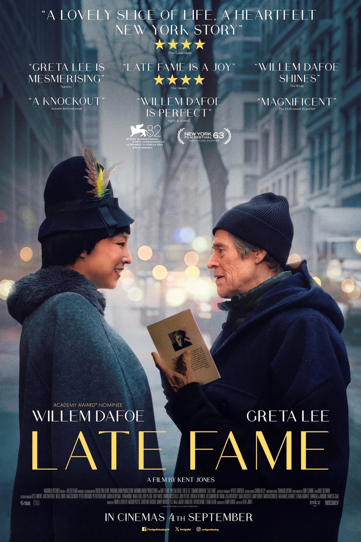 Late Fame poster featuring Greta Lee and Willem Dafoe facing each other on a New York street
