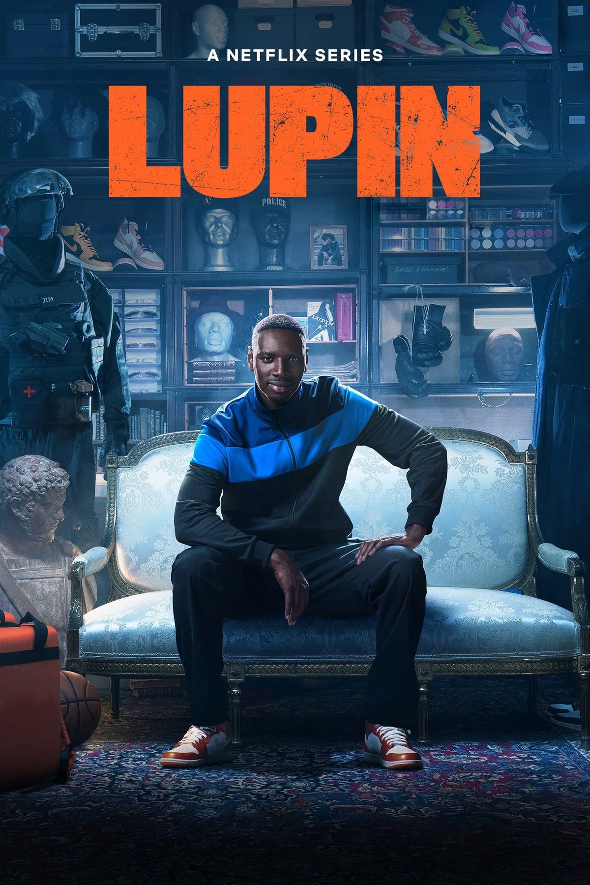 Lupin poster featuring Omar Sy seated beneath orange title lettering