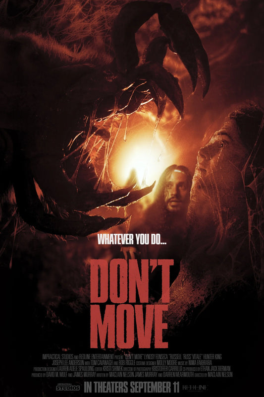 Don't Move horror poster showing a person amid orange fire and giant arachnid claws